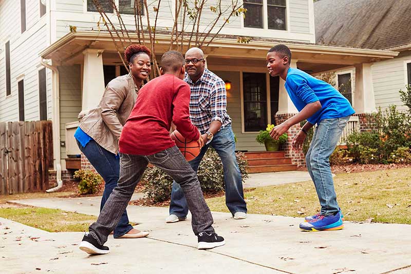 family playing basketball